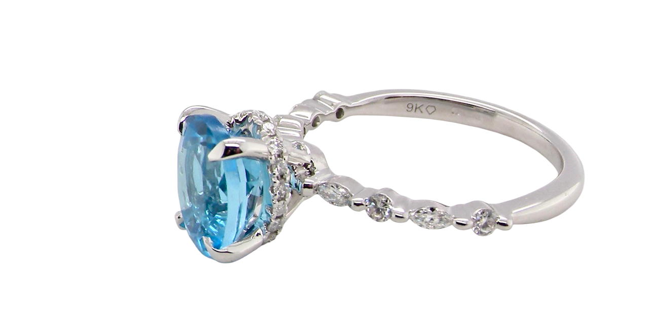 side A NEW ring- but with a gemstone that we have taken from an old ring that was worn out, so its a new lease of life! The topaz measures 9x7mm.