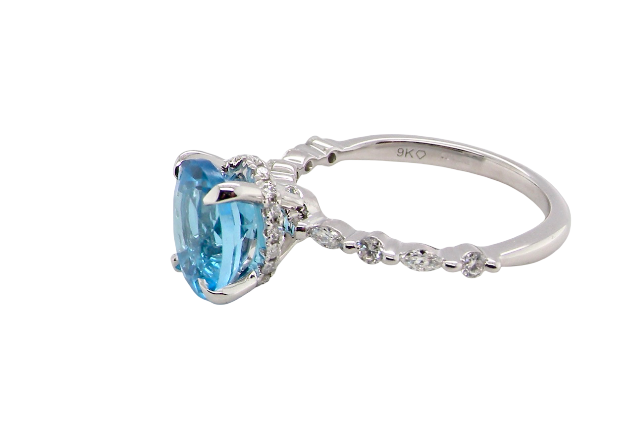 side A NEW ring- but with a gemstone that we have taken from an old ring that was worn out, so its a new lease of life! The topaz measures 9x7mm.
