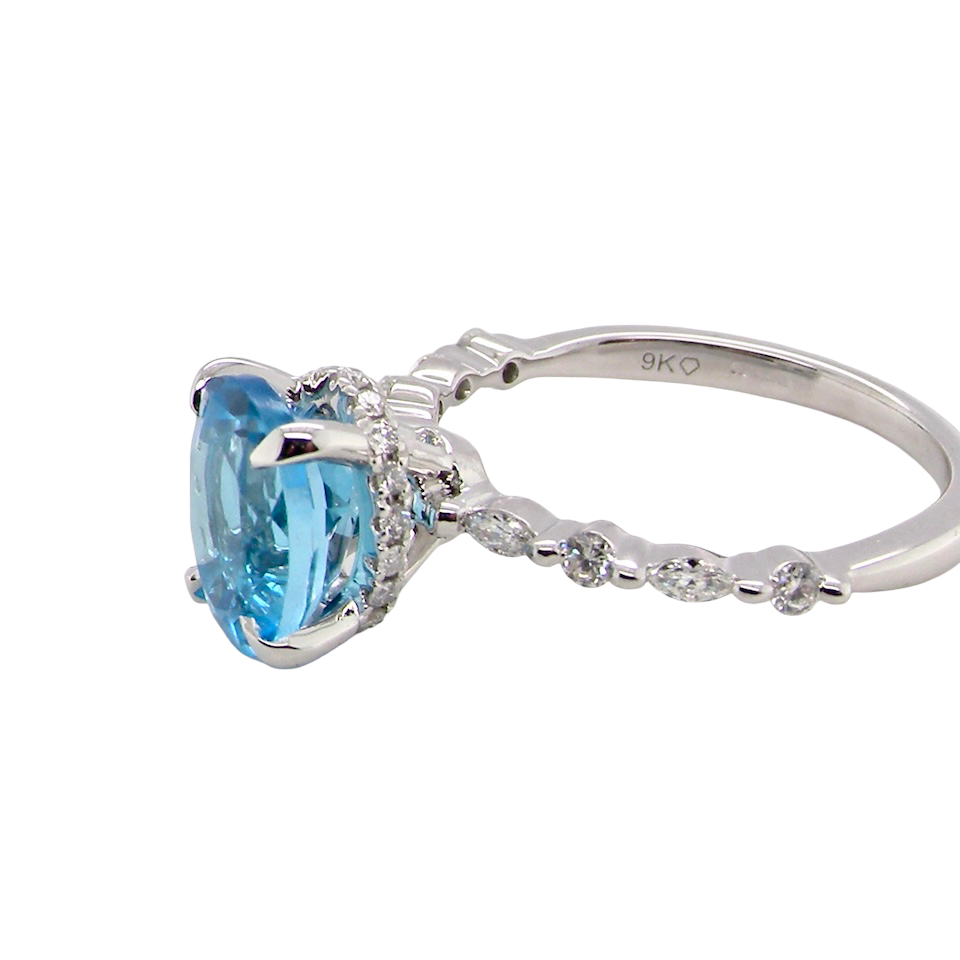 side A NEW ring- but with a gemstone that we have taken from an old ring that was worn out, so its a new lease of life! The topaz measures 9x7mm.