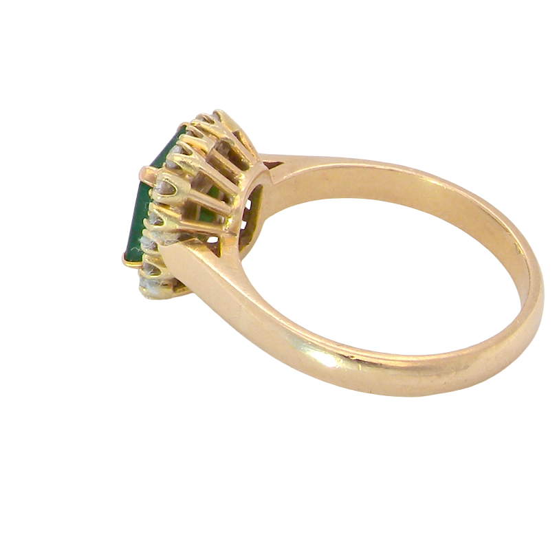 side A beautiful cluster ring set with a large square-cut emerald measuring approximately 7 x 7mm, displaying a deep grass-green colour with natural inclusions, as expected in emeralds.