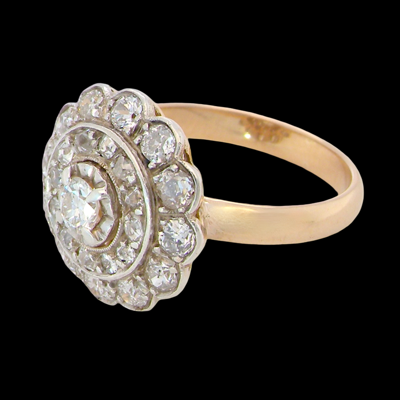 side A beautiful vintage diamond cluster ring. Know as a target cluster, the diamonds are old brilliant cut. Centre diamond 3.8mm (0.20 carats) . 