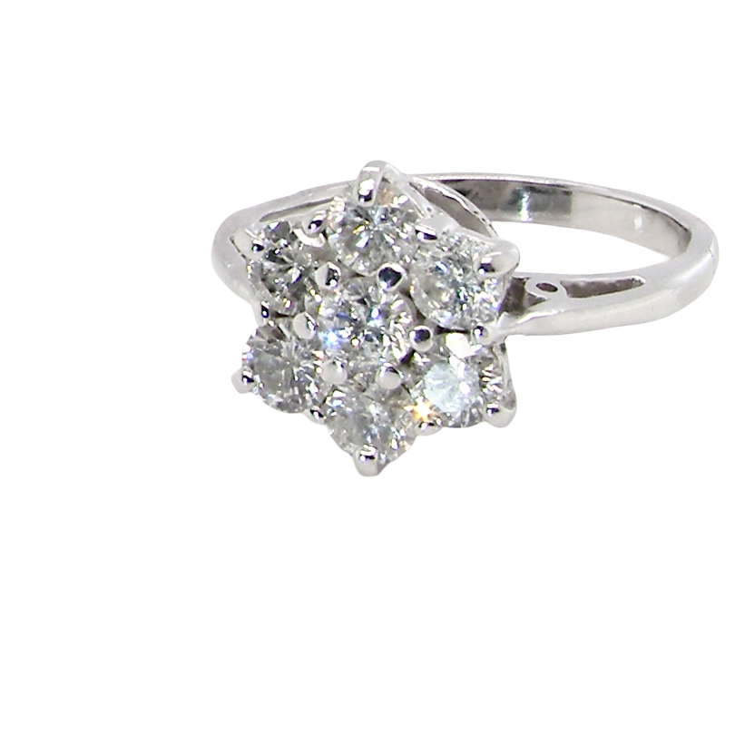 side A beautiful vintage diamond cluster ring, elegantly set with seven brilliant-cut white diamonds in a timeless floral cluster design.