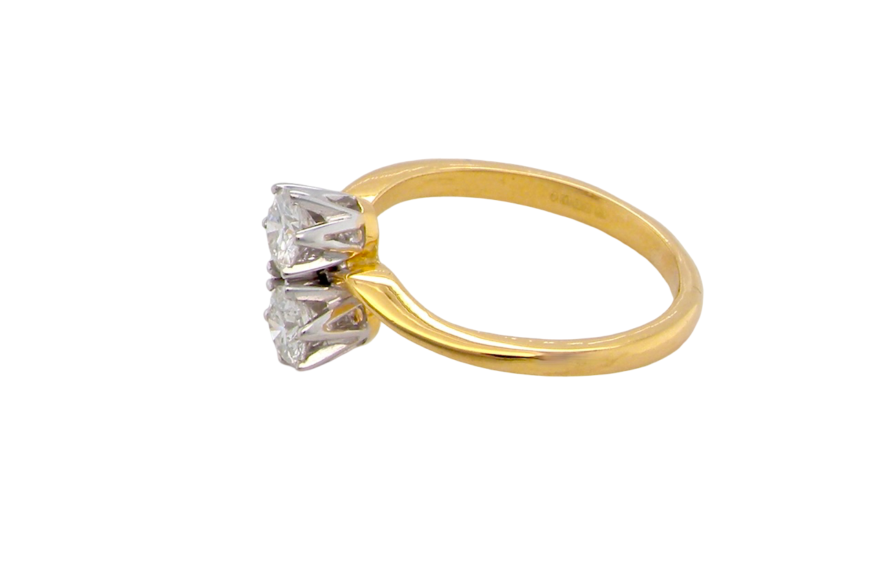 side A beautifully balanced Moi et Toi ring featuring two sparkling modern brilliant-cut diamonds