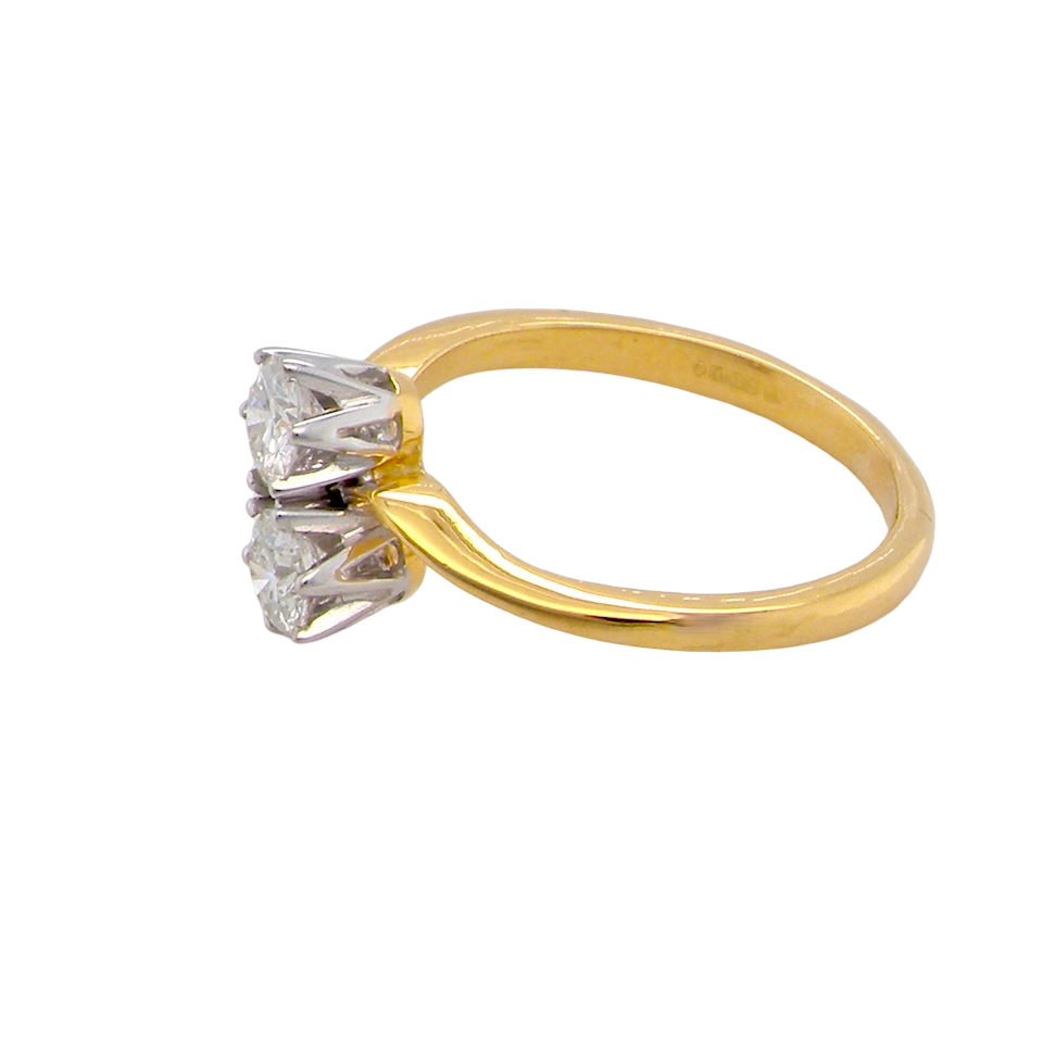 side A beautifully balanced Moi et Toi ring featuring two sparkling modern brilliant-cut diamonds