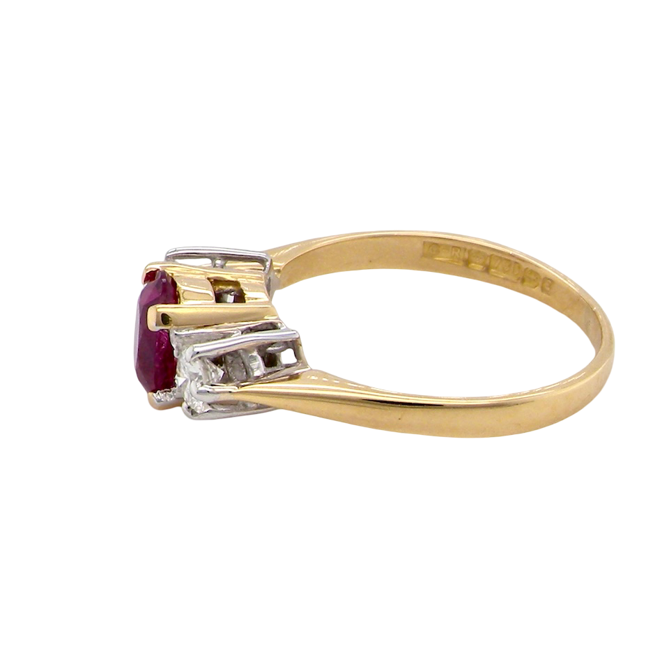 side A beautifully crafted vintage ruby trilogy ring in rich 18-carat gold