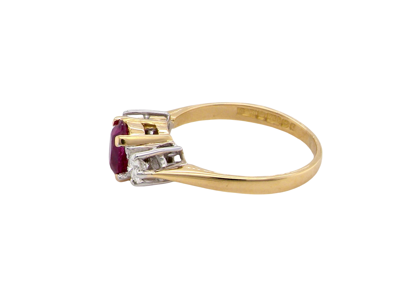 side A beautifully crafted vintage ruby trilogy ring in rich 18-carat gold