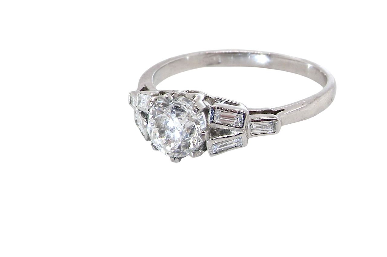 side A beautifully proportioned Art Deco solitaire ring showcasing a sparkling old brilliant cut white diamond