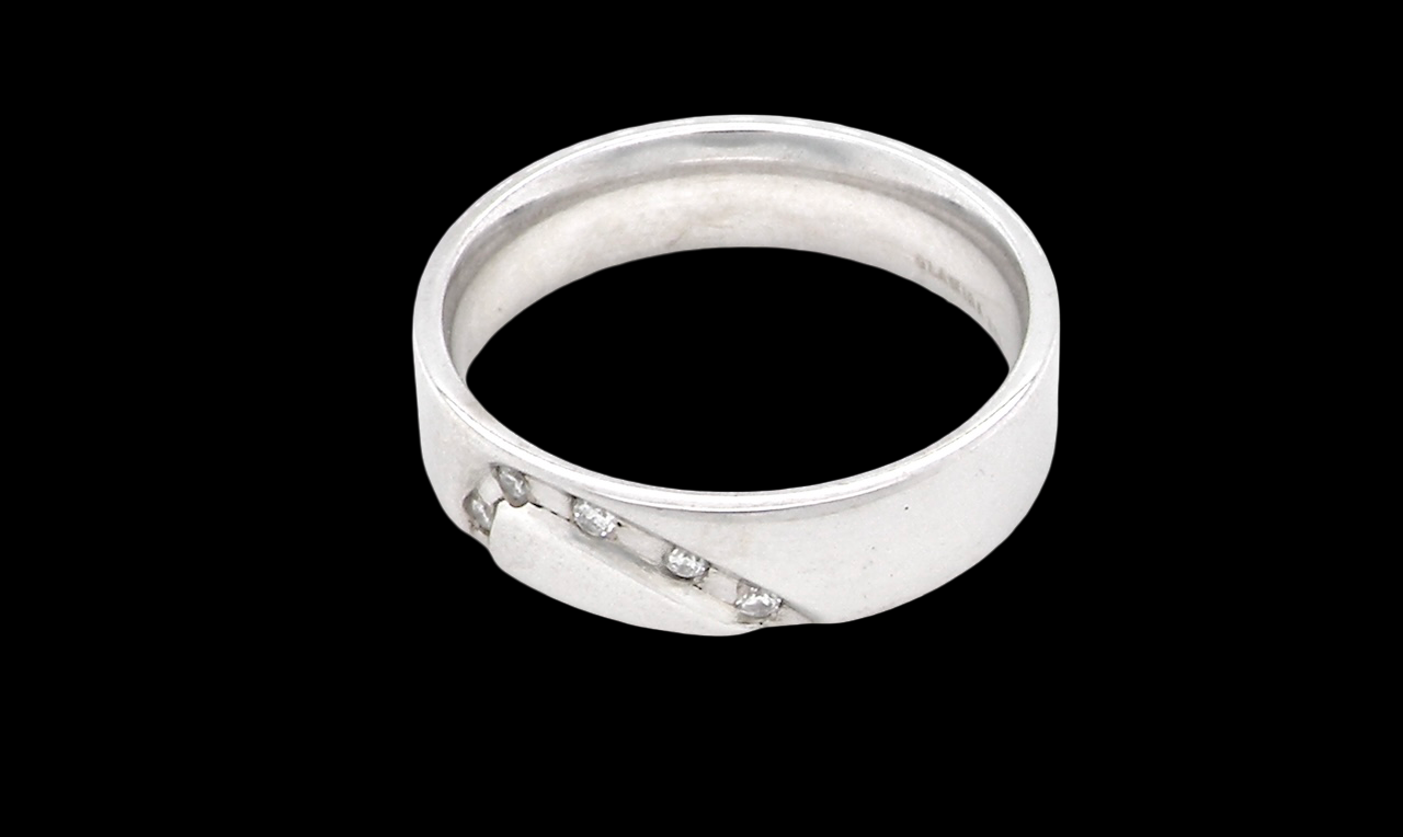 side A classic 9 carat white gold ring with a timeless wedding-band style, equally suited to wear as a simple diamond dress ring.