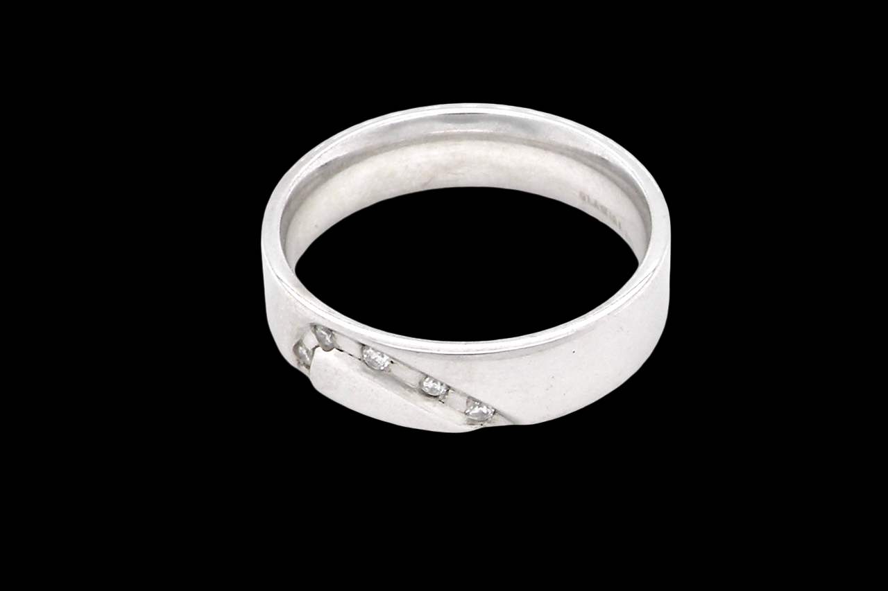 side A classic 9 carat white gold ring with a timeless wedding-band style, equally suited to wear as a simple diamond dress ring.