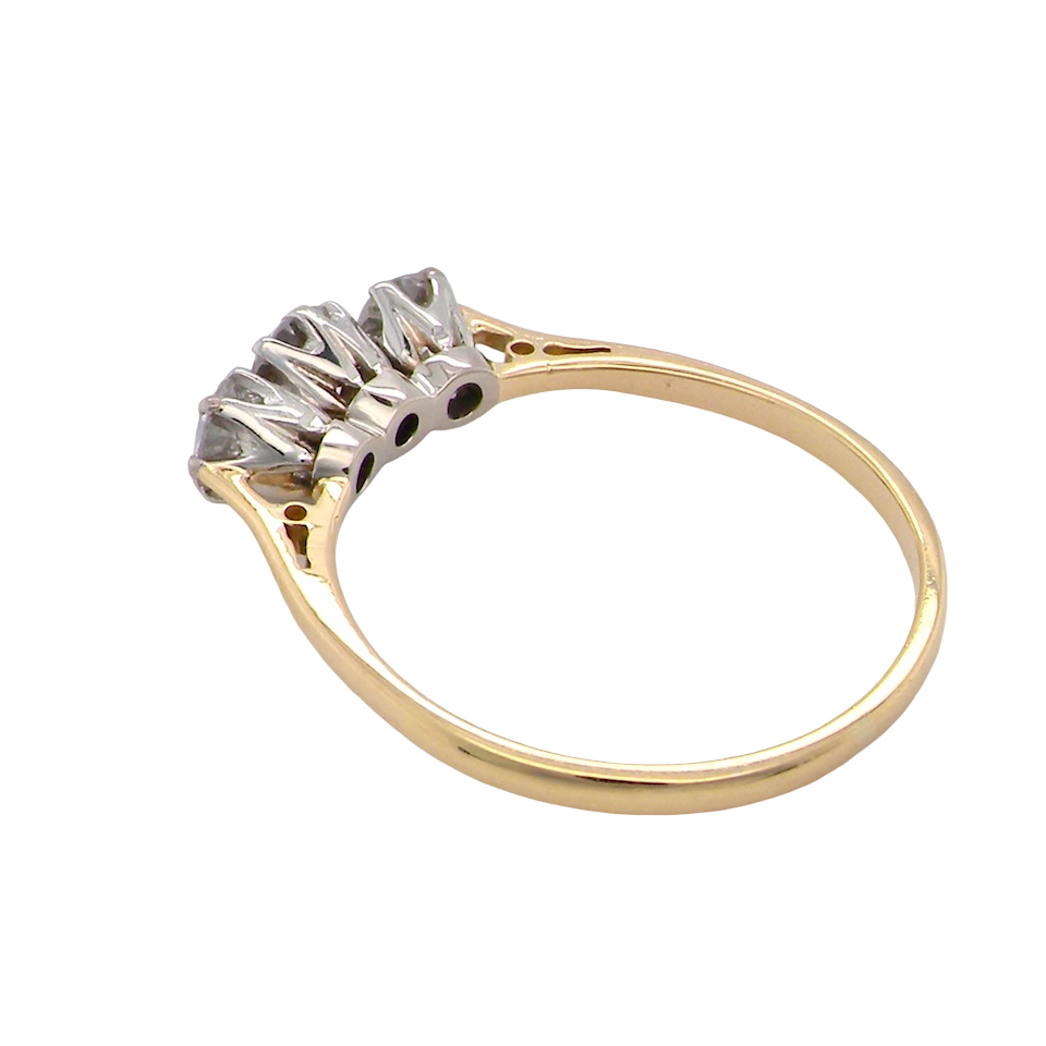 Gold ring with a diamond on a white background