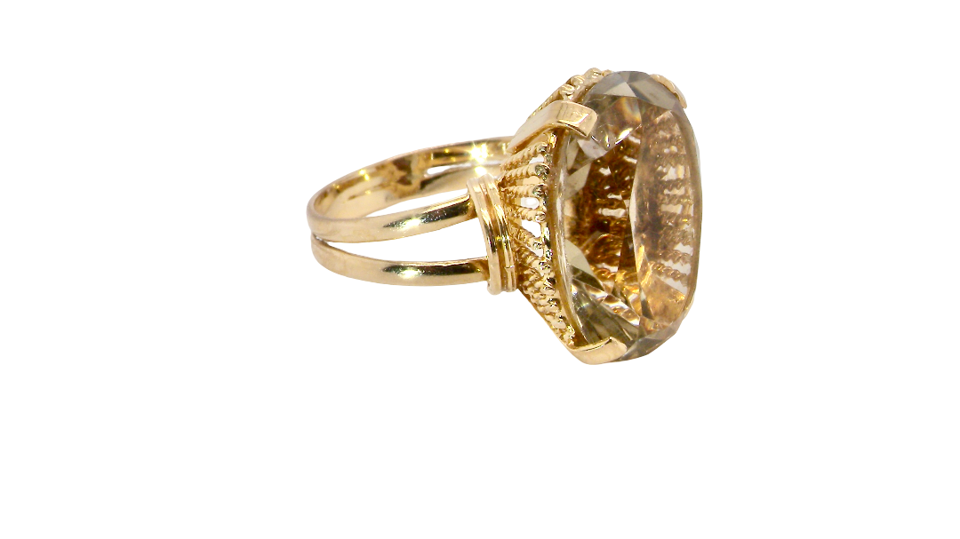 side A continental dress ring that tests as 18 carat gold. Features a large citrine gemstone, that measures 18x13mm, depth 9mm. Golden yellow with a hint of olive green. 
