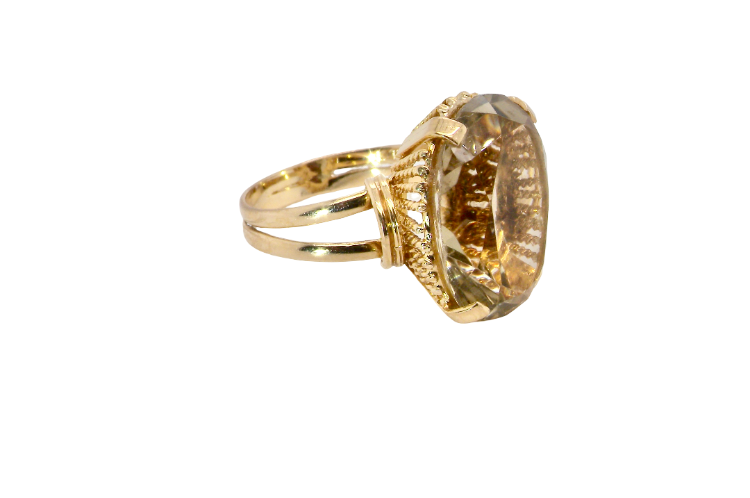side A continental dress ring that tests as 18 carat gold. Features a large citrine gemstone, that measures 18x13mm, depth 9mm. Golden yellow with a hint of olive green. 