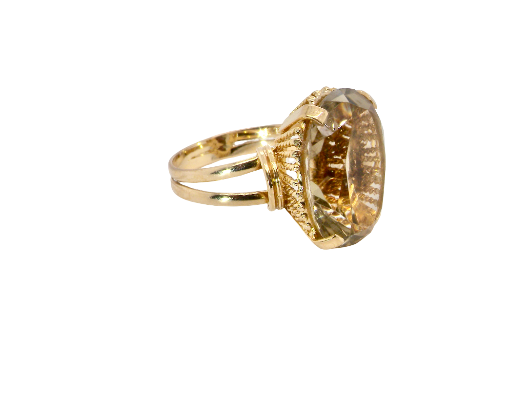 side A continental dress ring that tests as 18 carat gold. Features a large citrine gemstone, that measures 18x13mm, depth 9mm. Golden yellow with a hint of olive green. 
