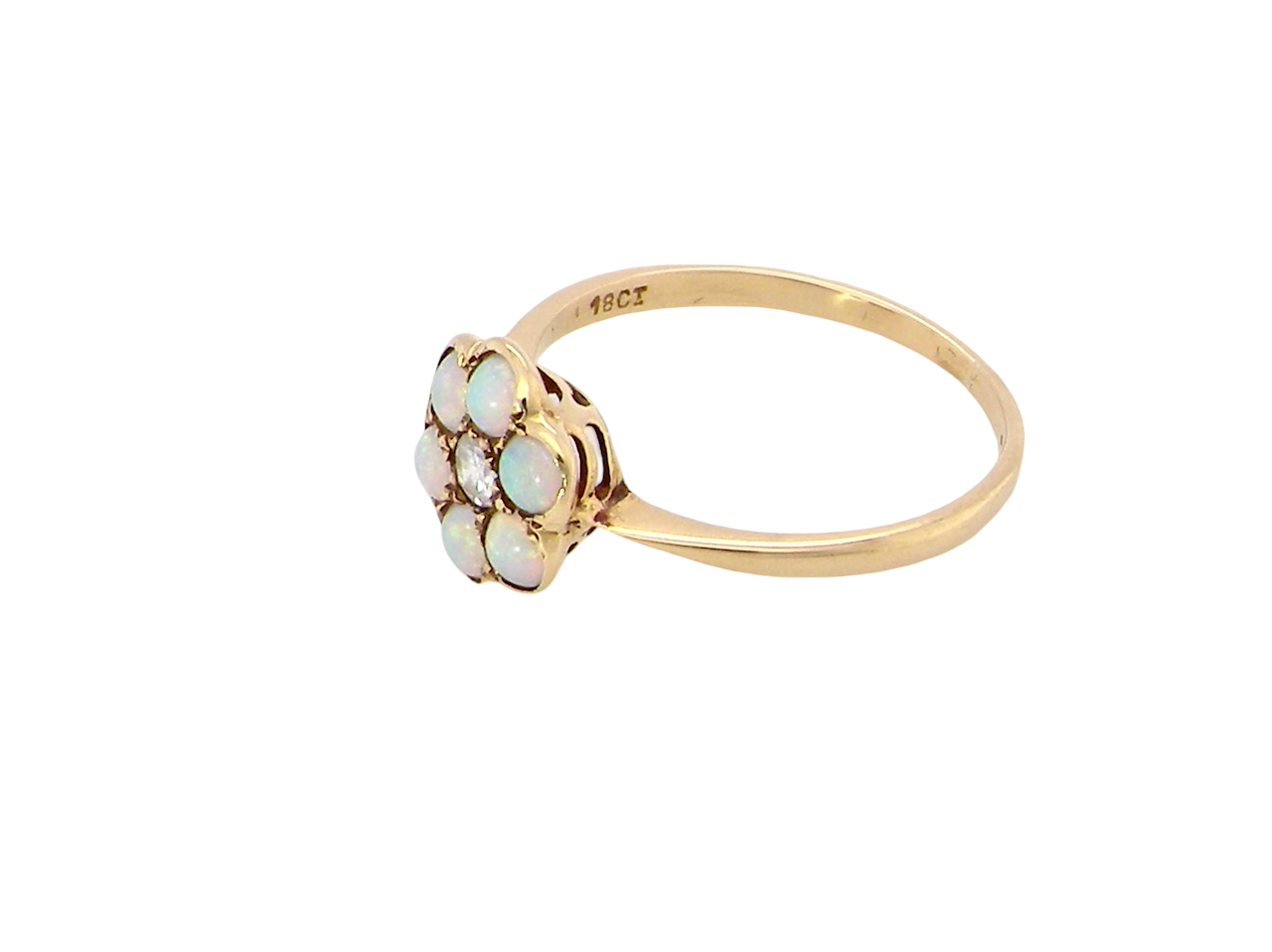 side A daisy cluster dress ring. Set with a small diamond centre stone, diameter 3mm (0.10 carats)