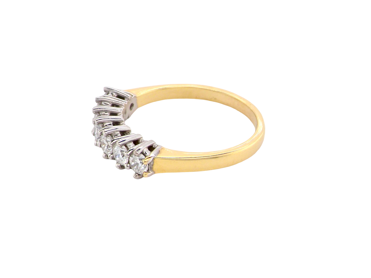 side A fine 18 carat gold half hoop eternity ring, beautifully set with an array of seven brilliant-cut white diamonds.