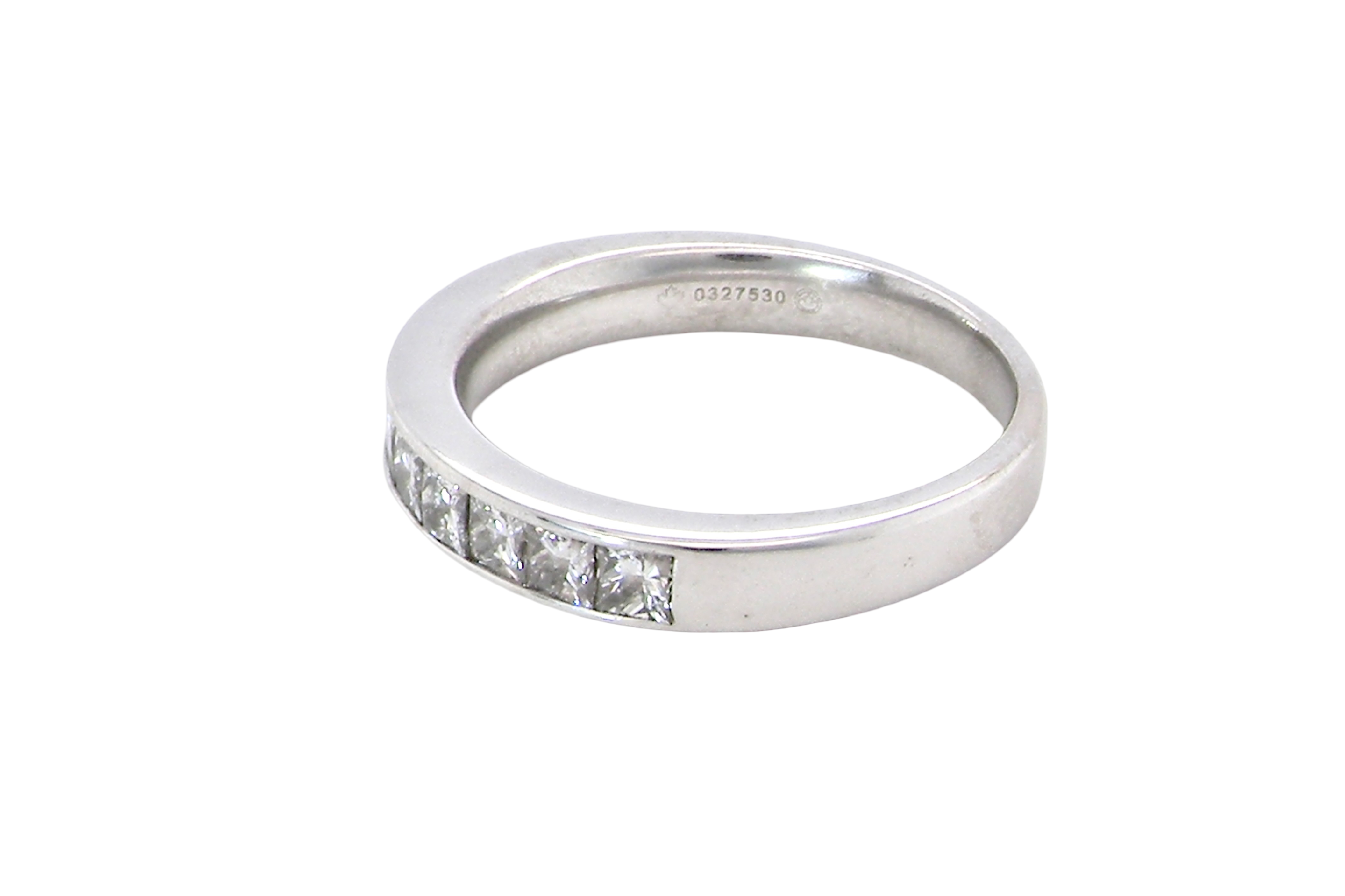 side A fine 18 carat white gold half hoop eternity ring. Set with ten princess cut white diamonds.
Close set, each 2.5x2.5mm, total one carat