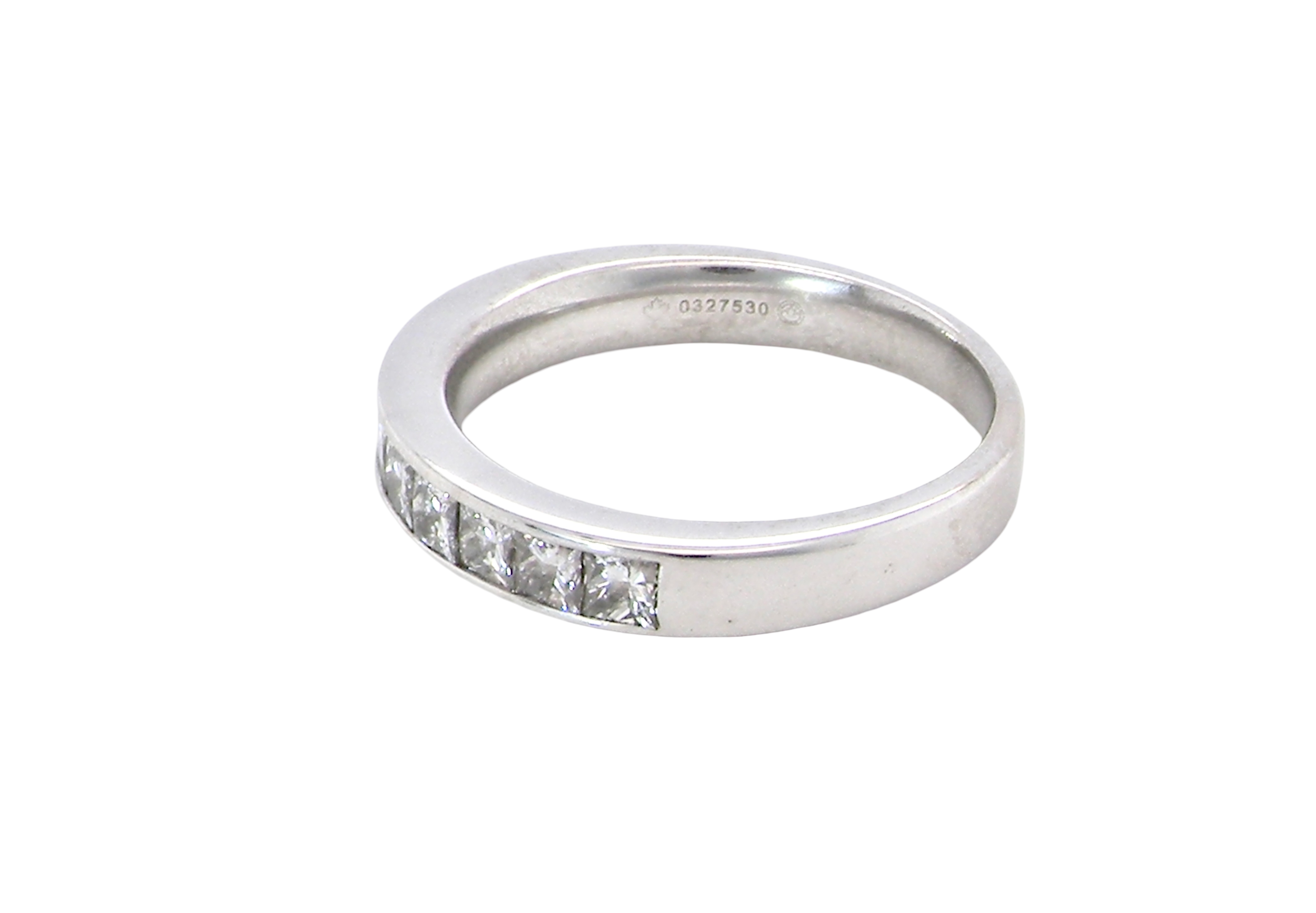 side A fine 18 carat white gold half hoop eternity ring. Set with ten princess cut white diamonds.
Close set, each 2.5x2.5mm, total one carat