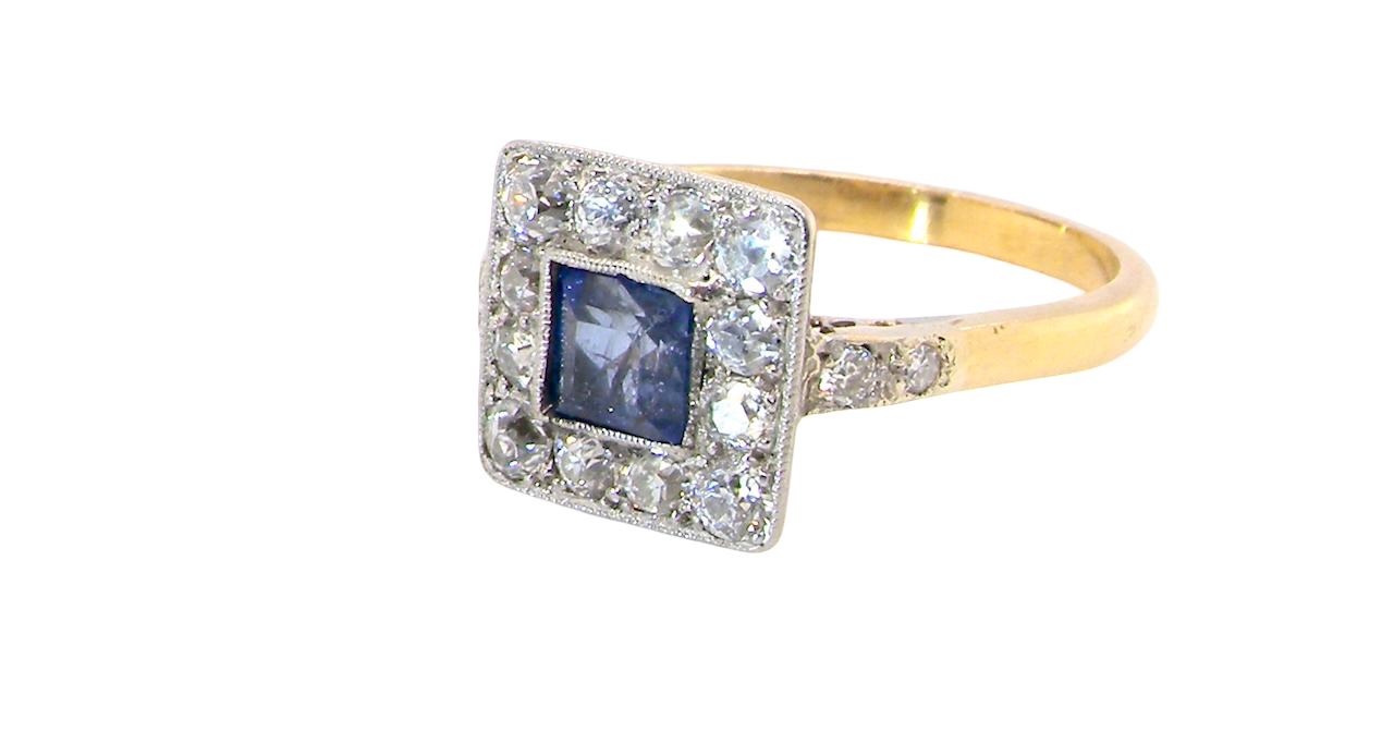 side A fine Art Deco cluster ring. The centre stone a square sapphire 5x5mm (est 0.50 carats) in a mille grain setting.