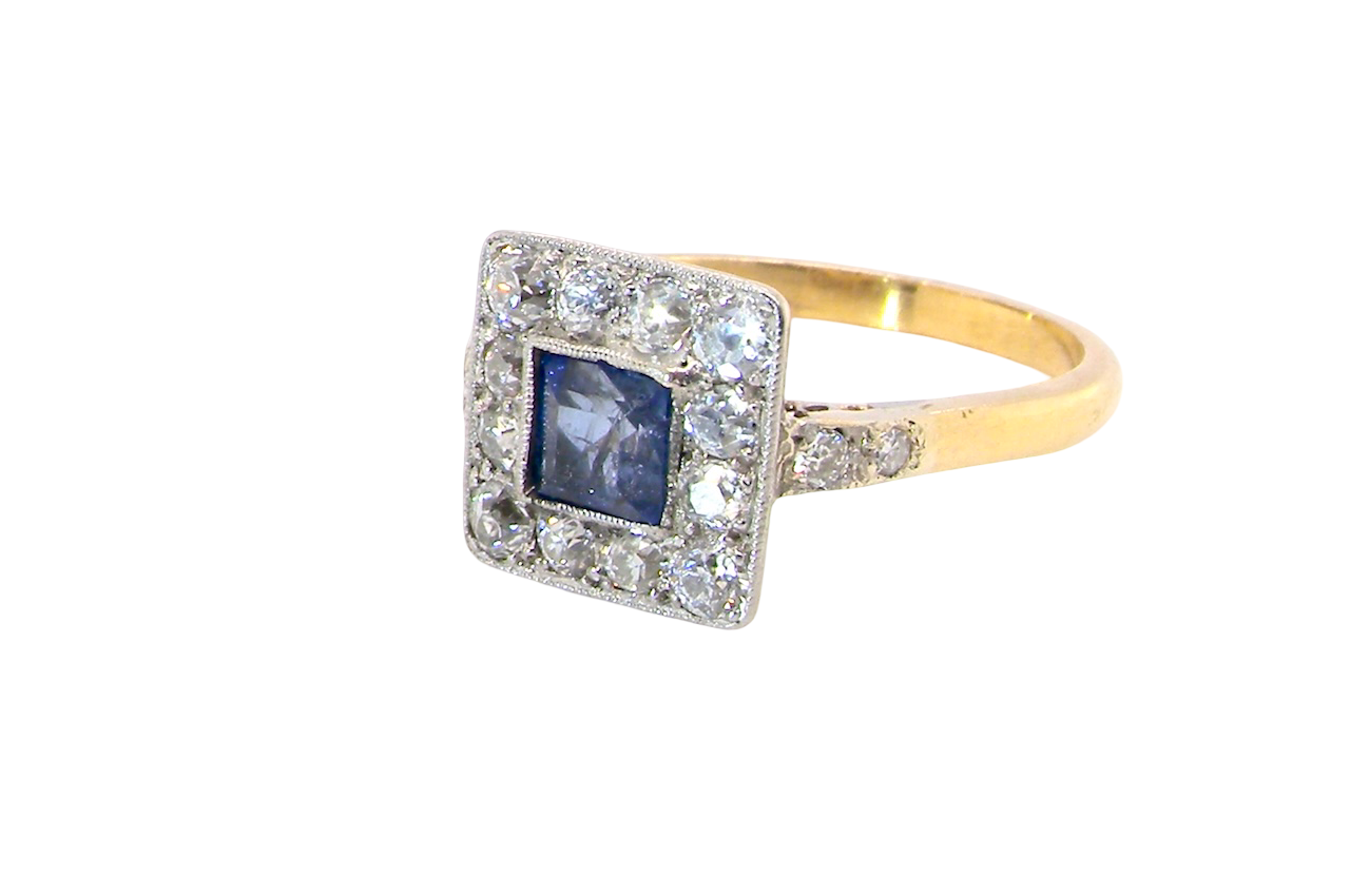 side A fine Art Deco cluster ring. The centre stone a square sapphire 5x5mm (est 0.50 carats) in a mille grain setting.