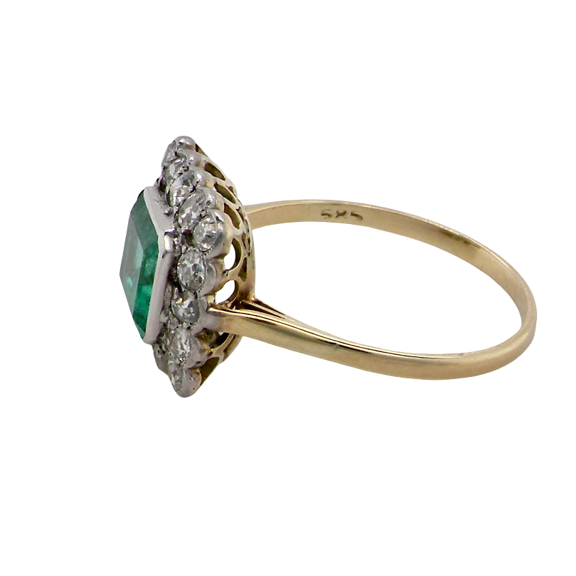 side A fine Art Deco emerald and diamond cluster ring, beautifully proportioned and displaying all the elegance associated with the period.