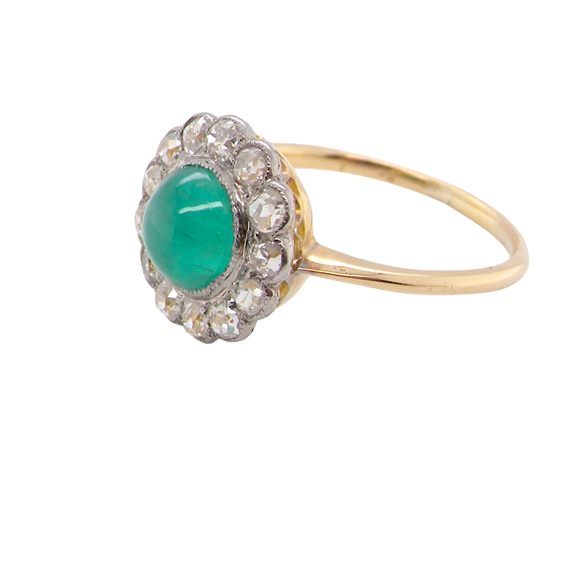 side A fine antique cluster ring. The centre stone a cabouchon cut emerald