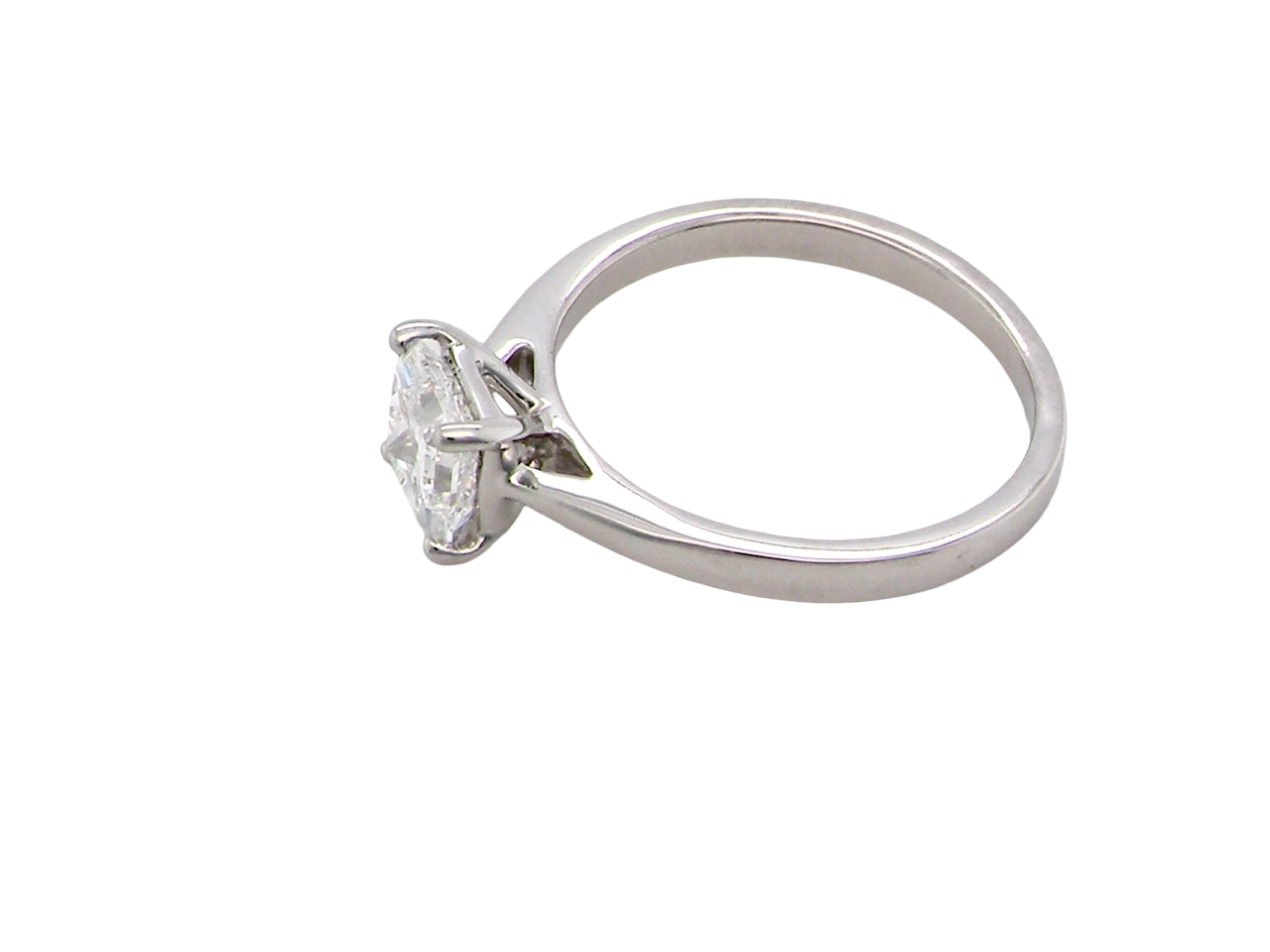 side A fine solitaire ring featuring a square cut diamond of excellent quality.
Superb colour grade of E, excellent clarity- graded VVS2*. Stone measures 5x5x3.68, confirmed as 0.83 carats.