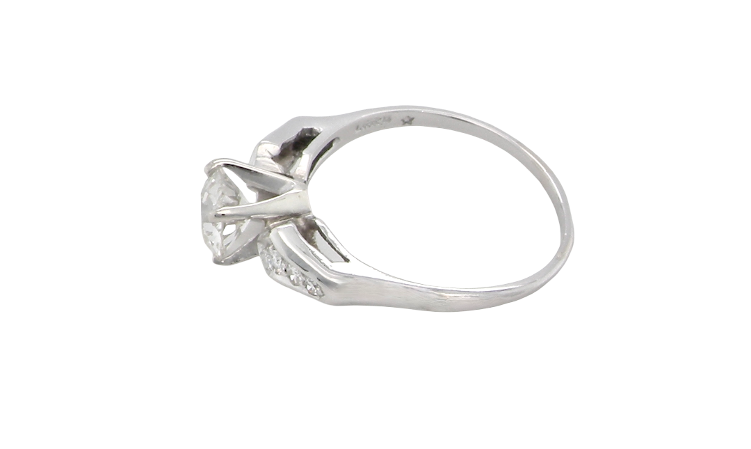 side A fine solitaire ring featuring an e lovely brilliant cut white diamond. Measures 6.3mm (est 0.85 carats) very bright white stone, colour H-i, clarity VS. Head depth 7mm. 