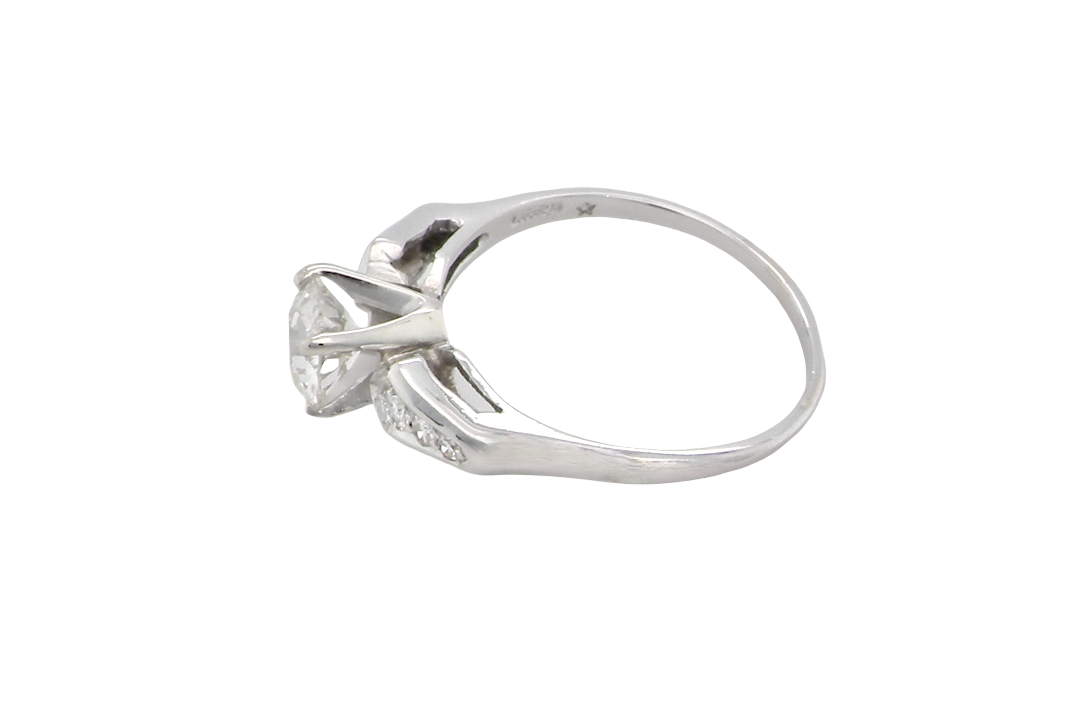 side A fine solitaire ring featuring an e lovely brilliant cut white diamond. Measures 6.3mm (est 0.85 carats) very bright white stone, colour H-i, clarity VS. Head depth 7mm. 