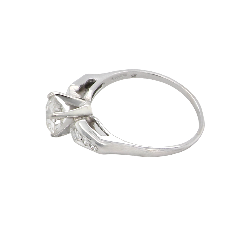 side A fine solitaire ring featuring an e lovely brilliant cut white diamond. Measures 6.3mm (est 0.85 carats) very bright white stone, colour H-i, clarity VS. Head depth 7mm. 