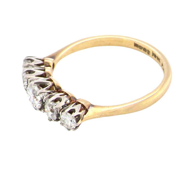 A vintage yellow gold ring with a five-stone diamond cluster setting, photographed on a clean white background.