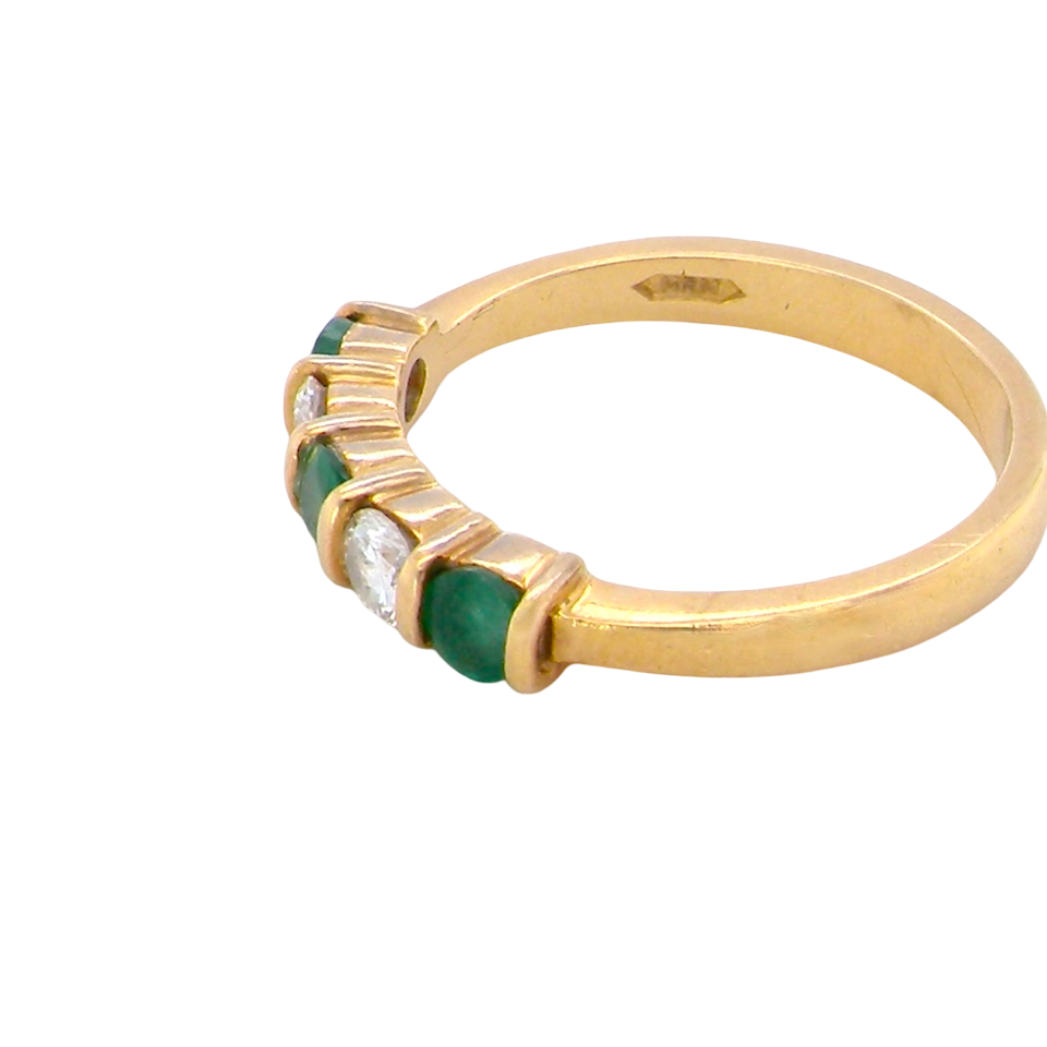 side A five stone ring set with three emeralds, each 3mm diameter.
Between each two brilliant cut white diamonds, each 3.4mm (0.15 carats each est), colour i-j, clarity Si.