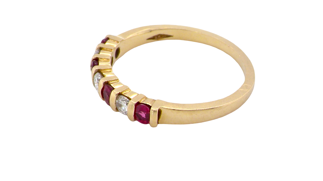 side A half hoop 18 carat yellow gold eternity ring. Set with four bright red rubies, each 2.6mm (total carat weight 0.28 est)