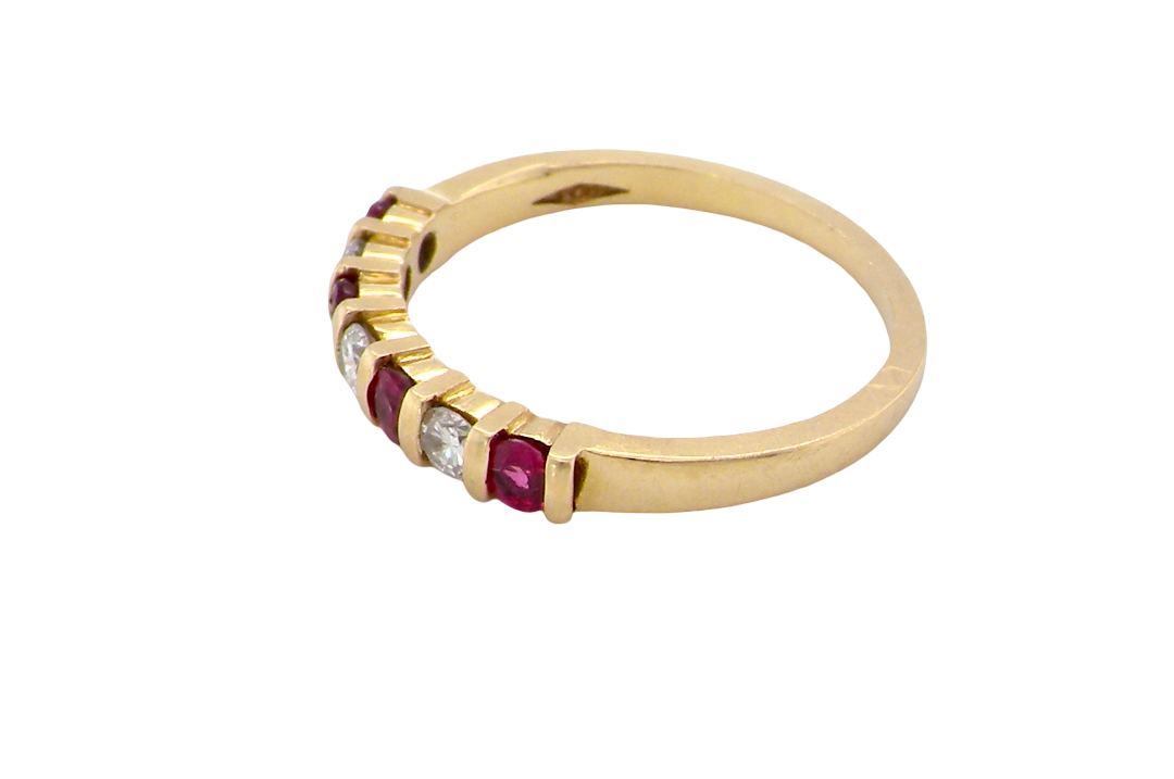 side A half hoop 18 carat yellow gold eternity ring. Set with four bright red rubies, each 2.6mm (total carat weight 0.28 est)