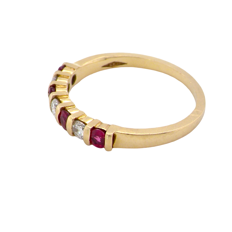 side A half hoop 18 carat yellow gold eternity ring. Set with four bright red rubies, each 2.6mm (total carat weight 0.28 est)