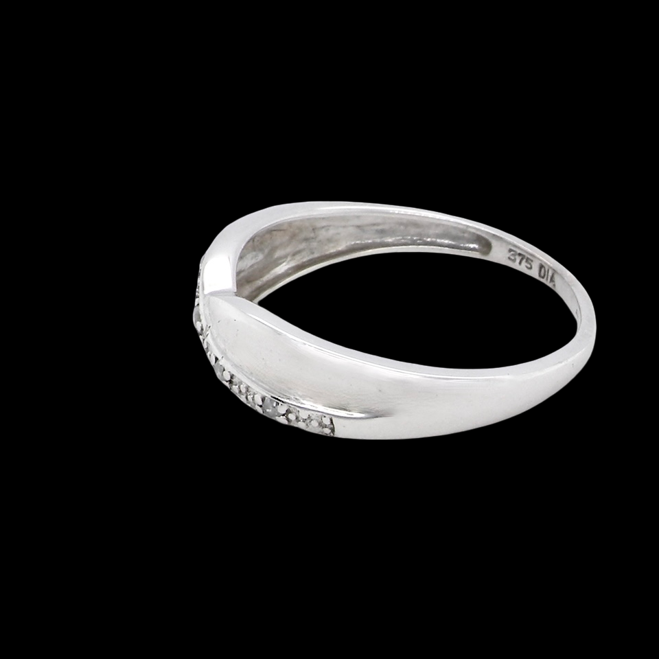 side A half hoop 9 carat white gold eternity ring. Set with five small white diamonds, each 1.3mm (total 0.05 carats)