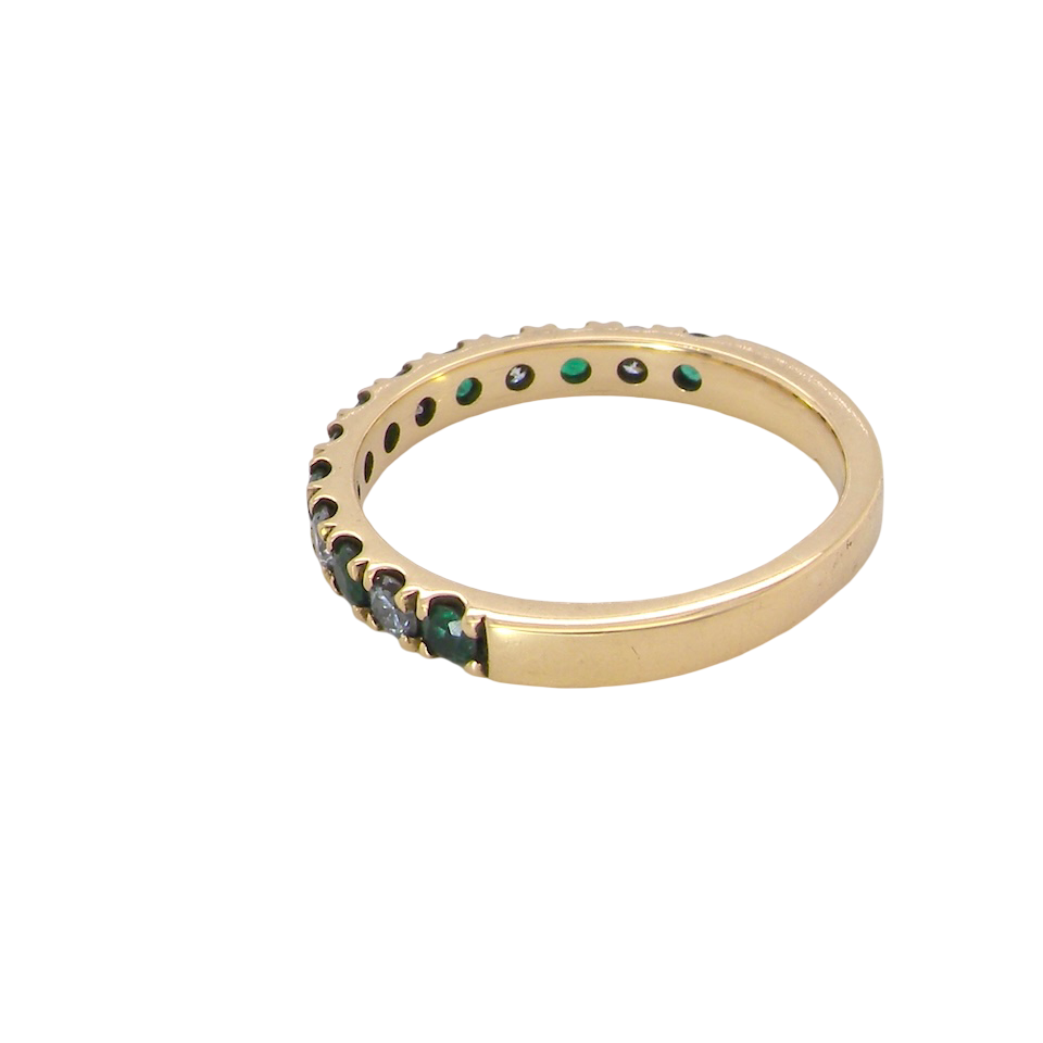 side A half hoop eternity ring. Set with seven emeralds,