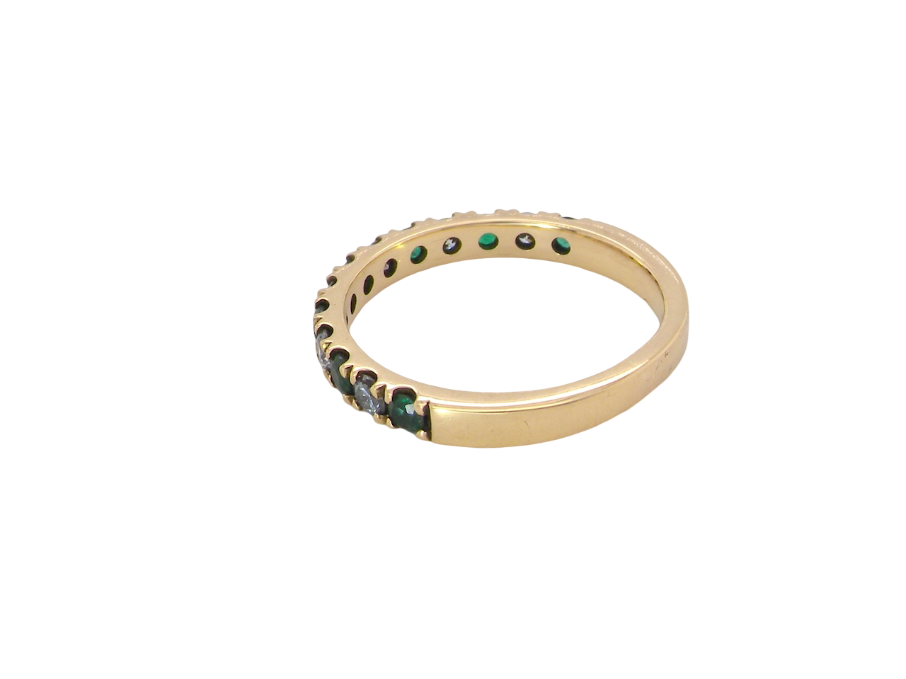 side A half hoop eternity ring. Set with seven emeralds,
