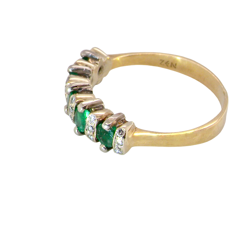side A half hoop ring, stamped 750 (testing as 18 carat gold)
Set with alternate gemstones, five bright green emeralds
