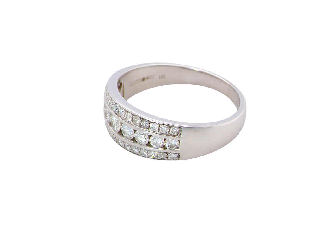 side A lovely 18 carat white gold half hoop ring. Set with a middle row of nine bright white brilliant cut diamonds, graduate from 2.2mm to 2.6mm. The top and bottom rows are also set with small diamonds.