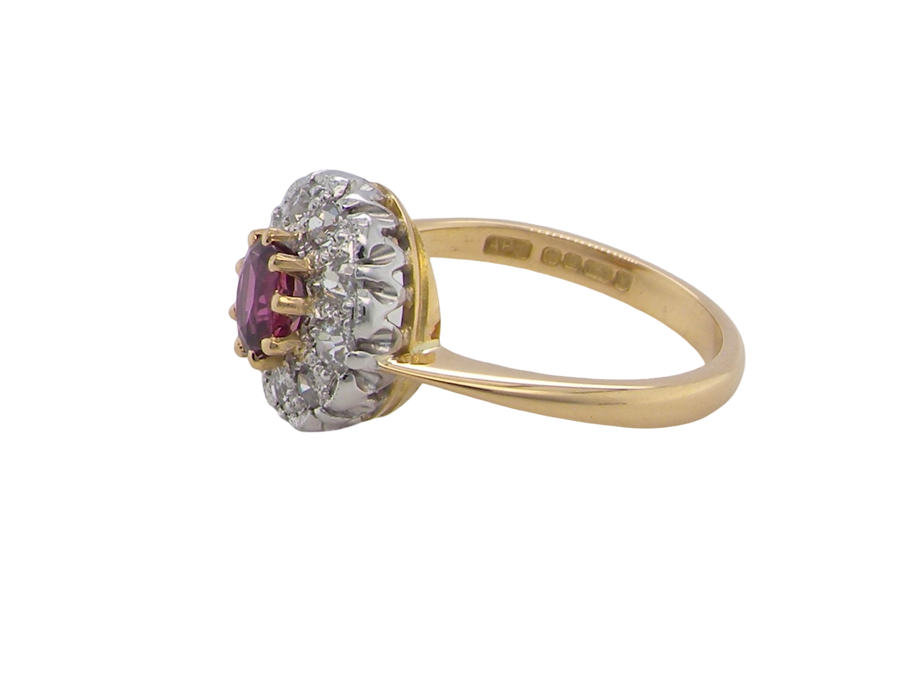 side A lovely daisy cluster ring that profiles to the centre a deep red ruby, 5mm (0.50 carats) yellow claw set.