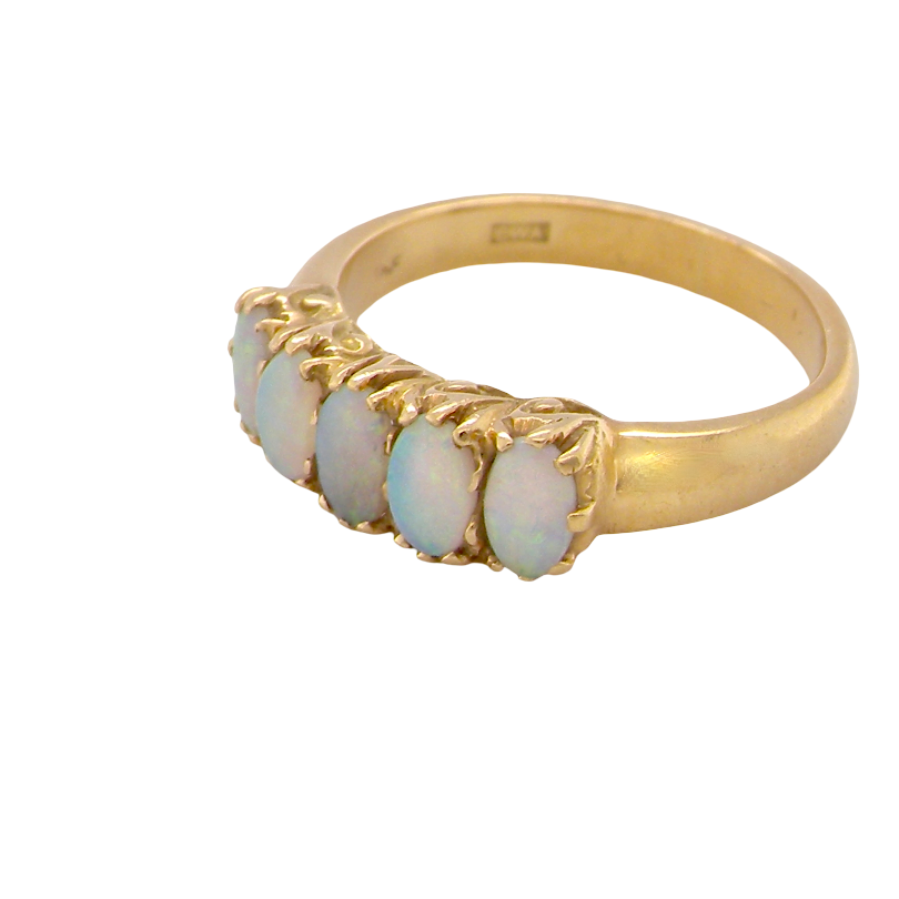 side A lovely five stone ring. Set with five oval white opals, each 5x3.5mm, good play of colour on all.
Carved head