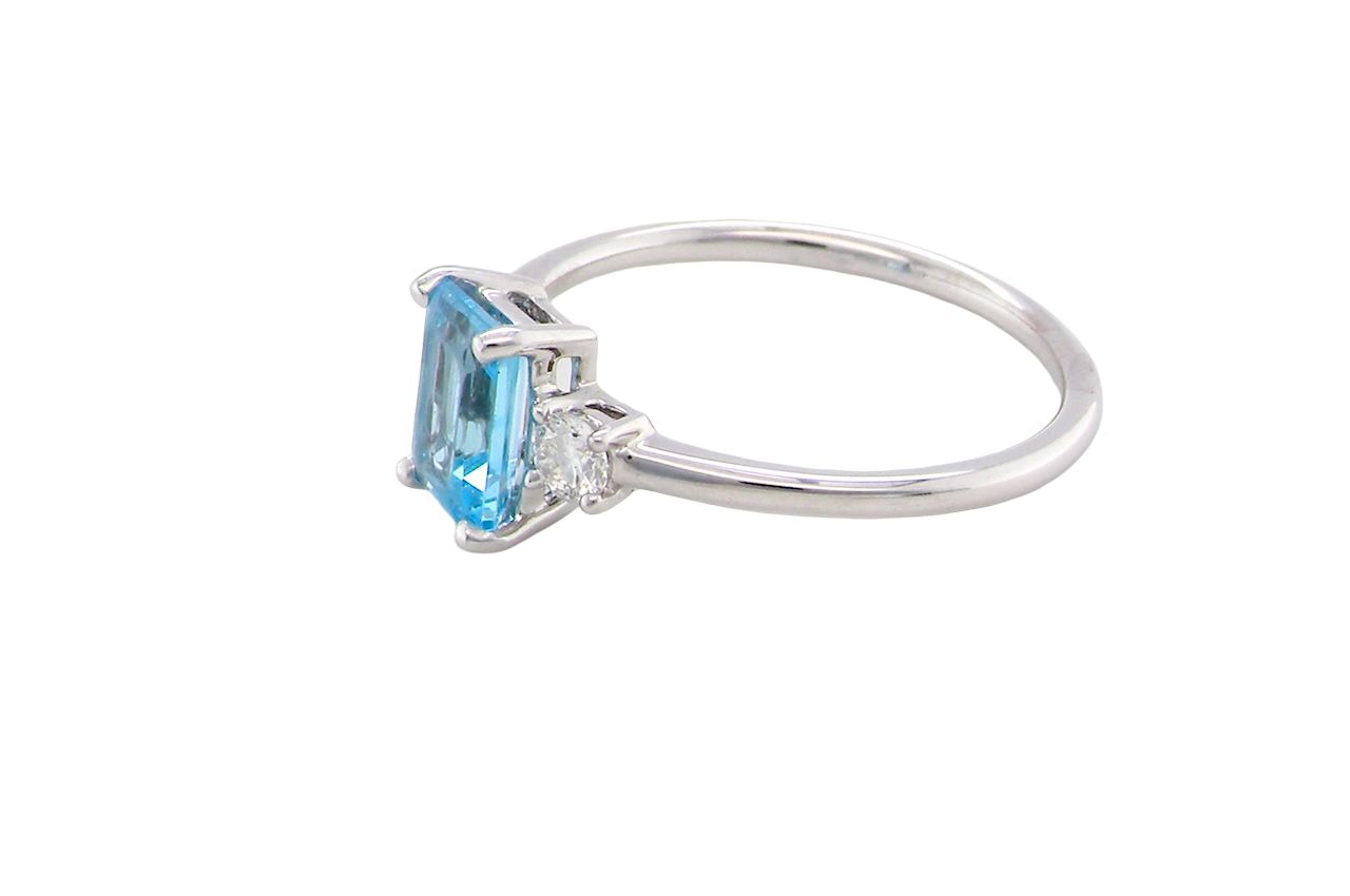 size A 9 carat white gold three stone ring. This ring is from our Heirloom Collection. This is when we take a stone from a pre-owned ring that is worn out, and reset it into a brand new setting.