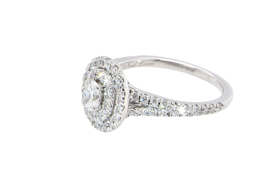 side A new diamond cluster ring* An oval diamond halo cluster ring. Set with brilliant cut white diamonds, colour H-k, clarity Si.