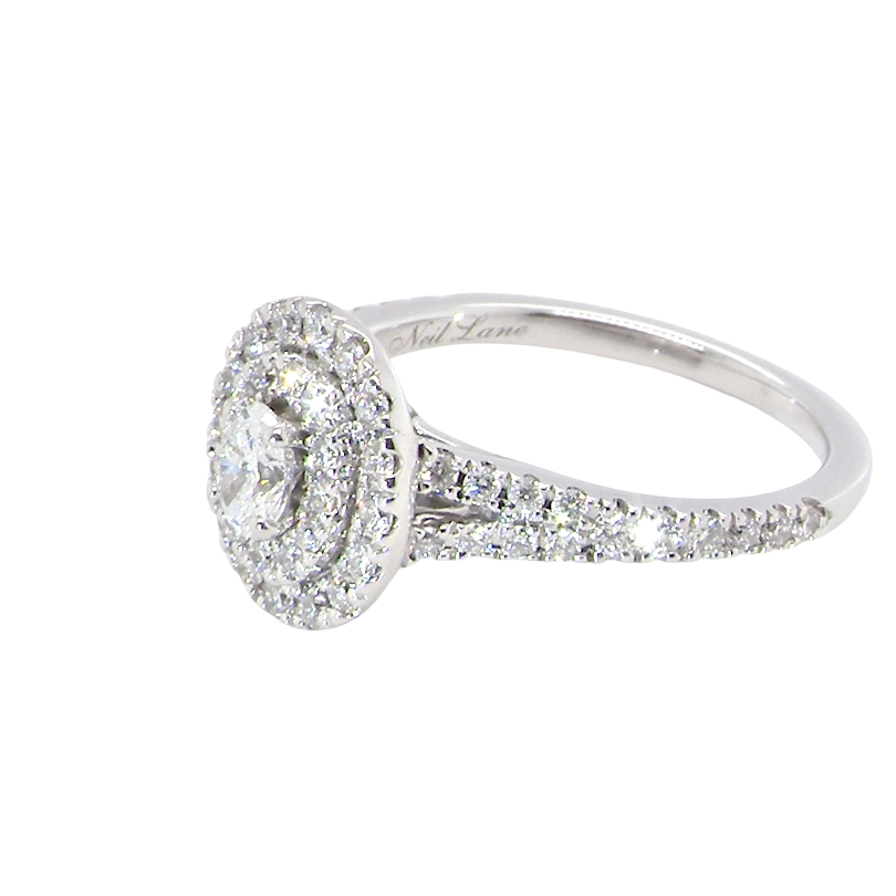 side A new diamond cluster ring* An oval diamond halo cluster ring. Set with brilliant cut white diamonds, colour H-k, clarity Si.