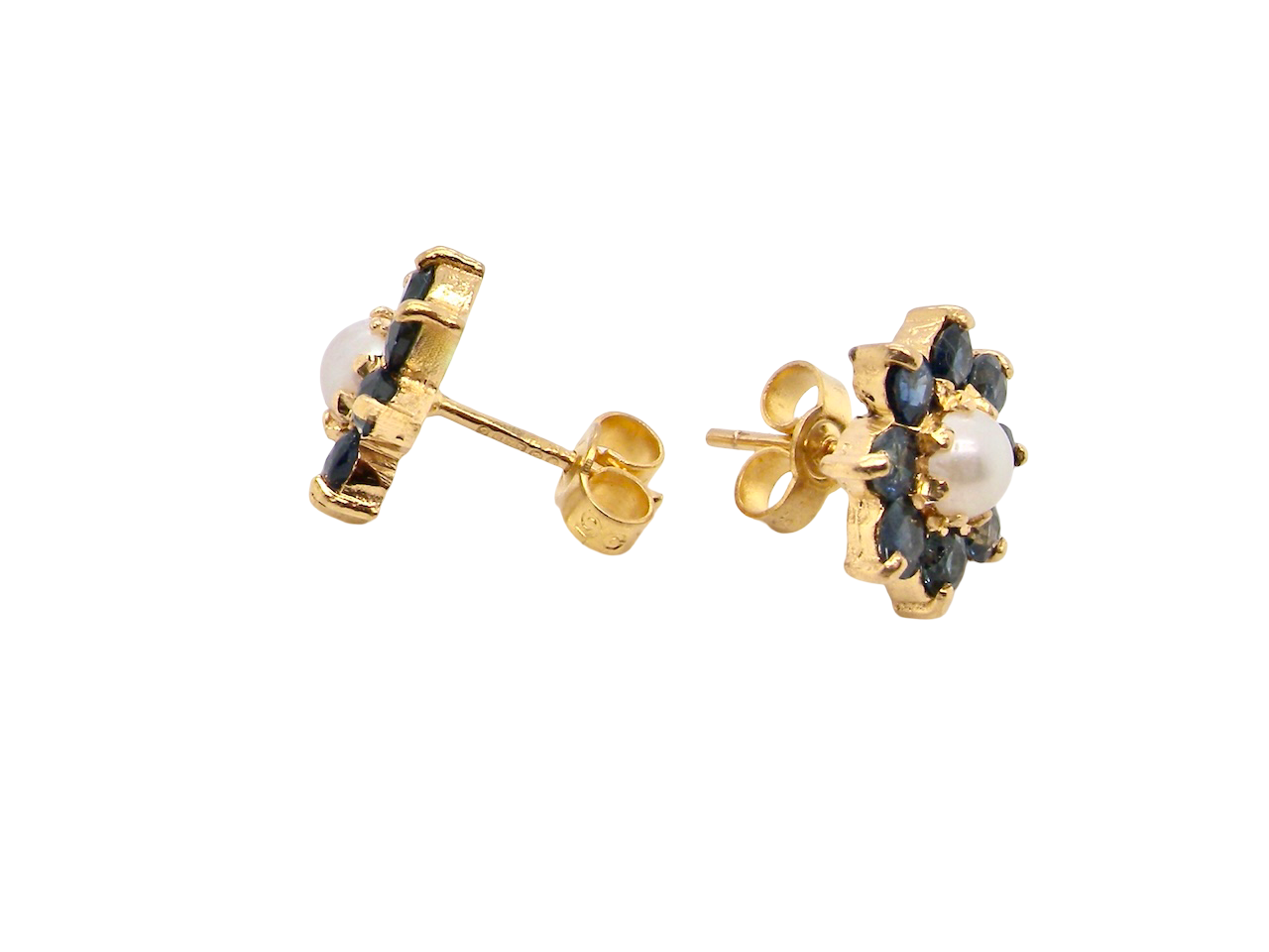 side A pair of 9 carat gold cluster earrings. The centre set with a cultured pearl 4mm diameter. Surrounded by eight round sapphires, each 3.3mm.