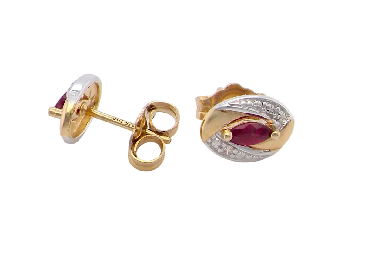 side A pair of 9 carat gold earrings.
Centre stone an marquise cut ruby, 5x3mm