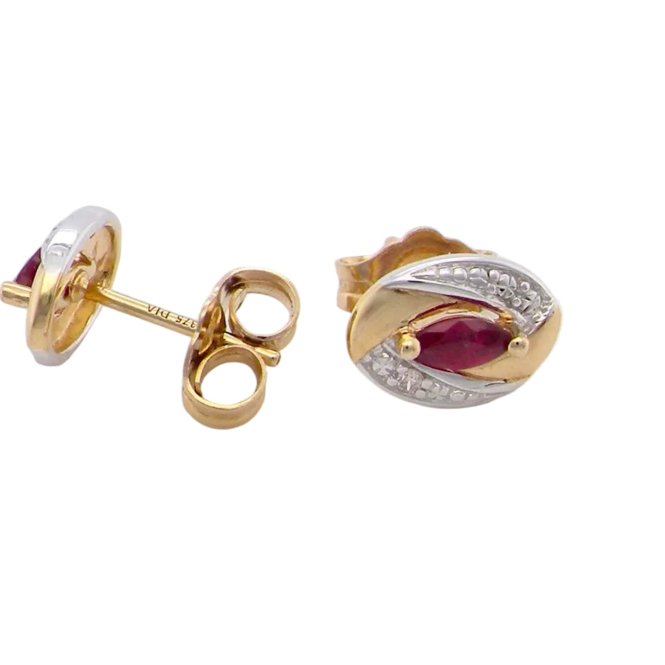 side A pair of 9 carat gold earrings.
Centre stone an marquise cut ruby, 5x3mm