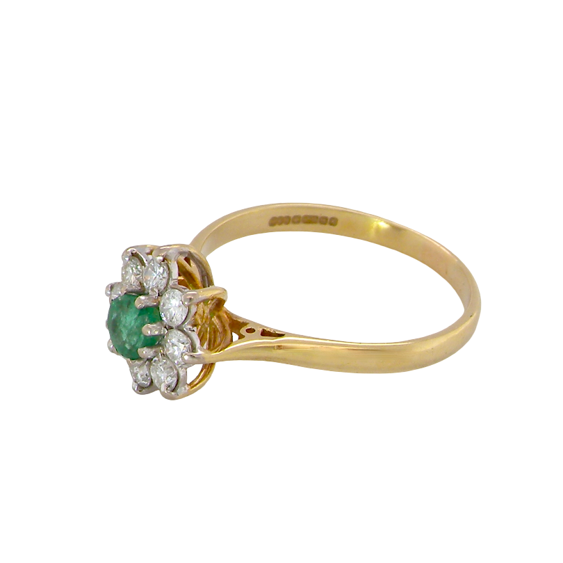 side A pretty 18 carat gold cluster ring. The centre stone is a round emerald 4mm diameter (0.25 carats) mid green colour.