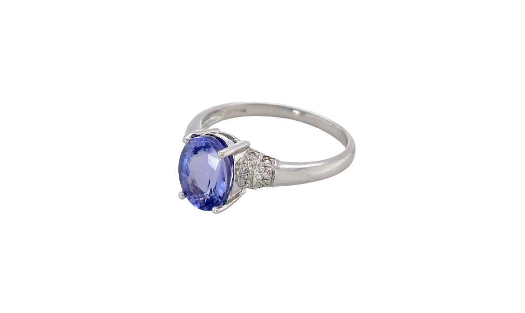 side A pretty 18 carat white gold ring that features an AAA Tanzanite gem stone. Displaying tones of purple and lilac the stone is oval cut at around 8x6mm (1.47 carat approx)