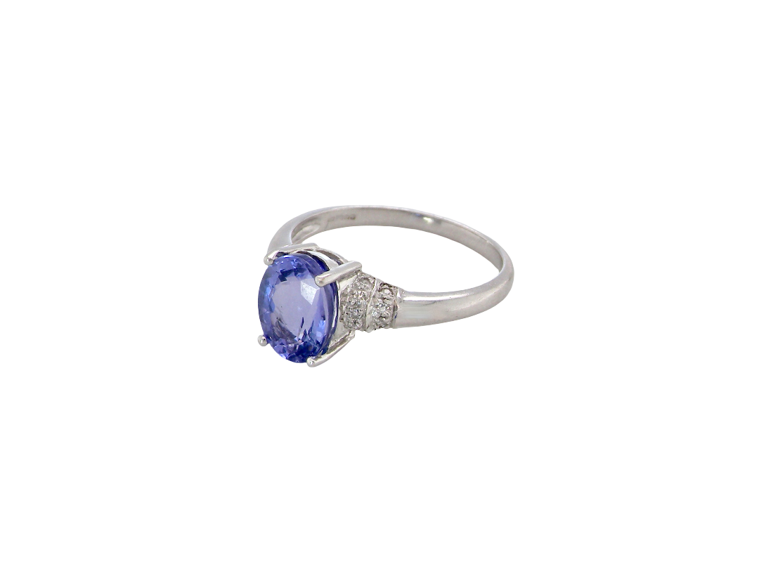 side A pretty 18 carat white gold ring that features an AAA Tanzanite gem stone. Displaying tones of purple and lilac the stone is oval cut at around 8x6mm (1.47 carat approx)